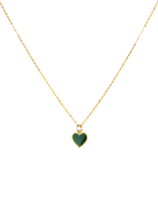 Gold necklace with a green heart pendant on a white background