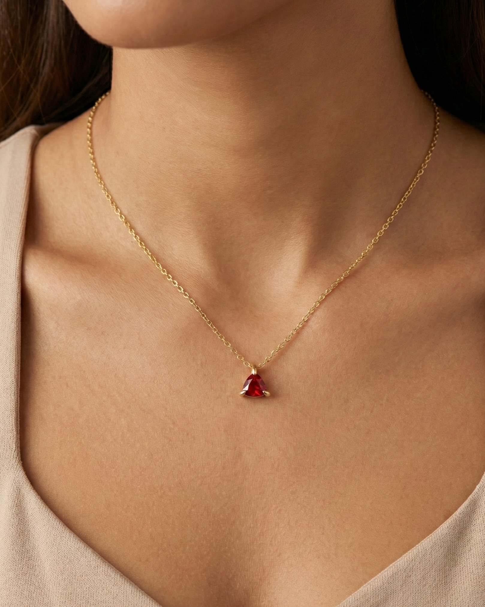 garnet pendant necklace on a model