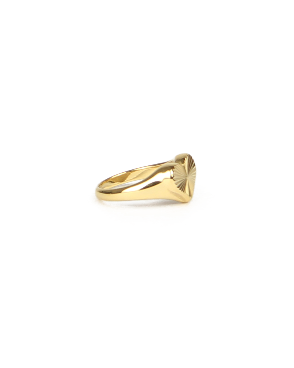 Gold ring with a geometric design on a white background