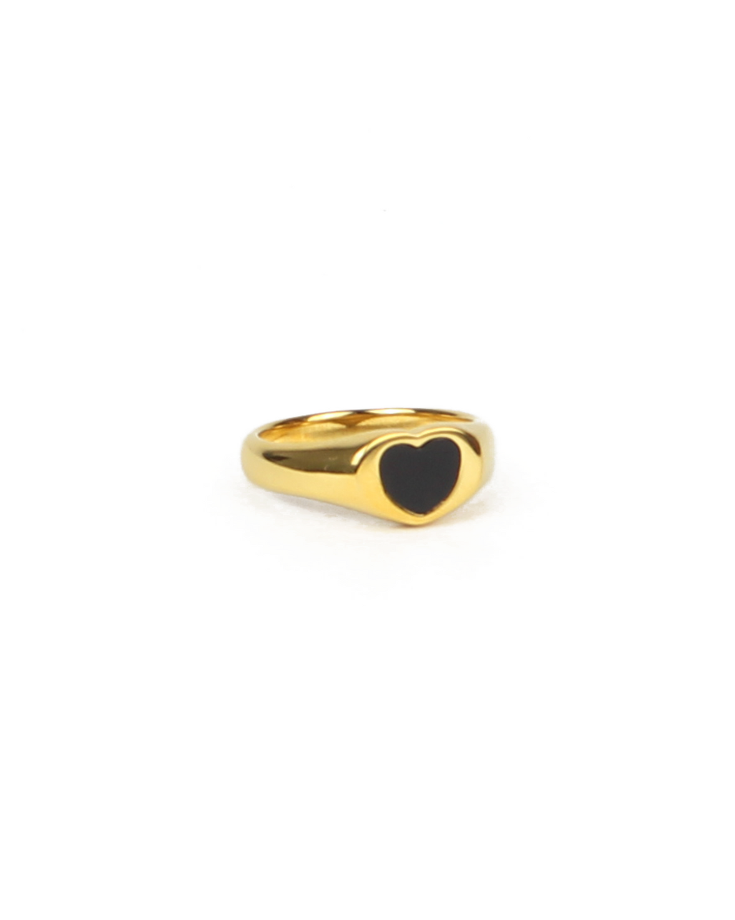 Gold ring with a black heart-shaped enamel on a white background