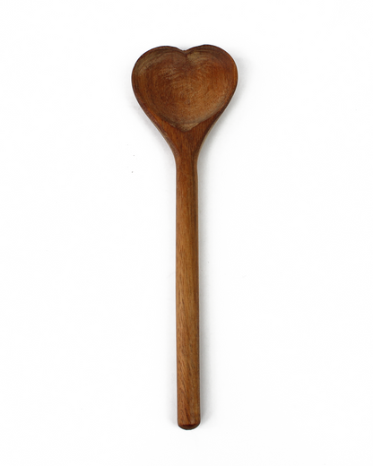 Wooden spoon with heart-shaped scoop on a white background