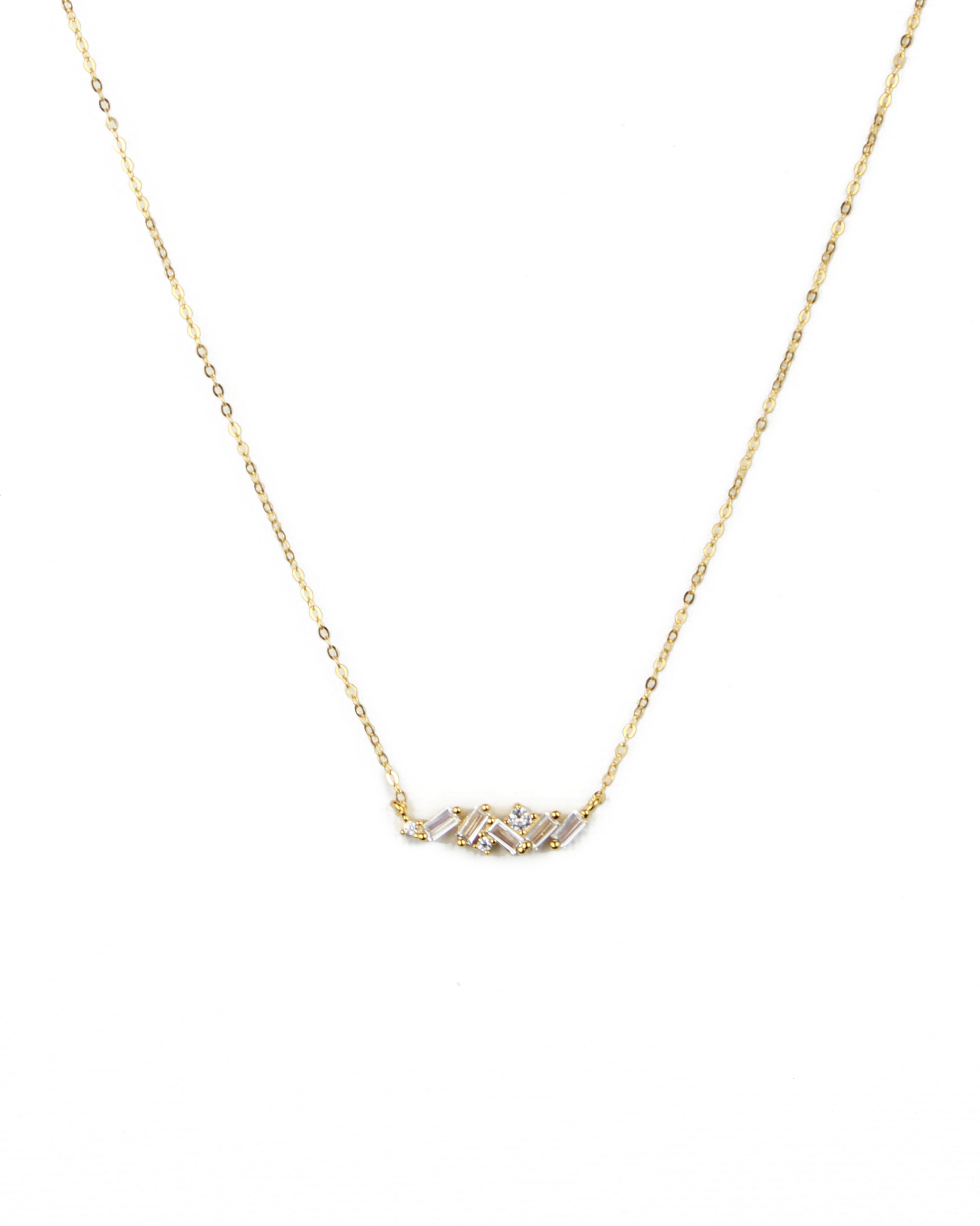 Gold necklace with a small pendant on a white background