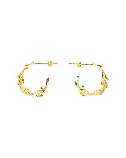 Pair of gold hoop earrings on a white background