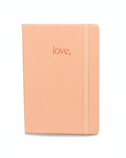 Coral-colored journal with 'love,' text on a white background