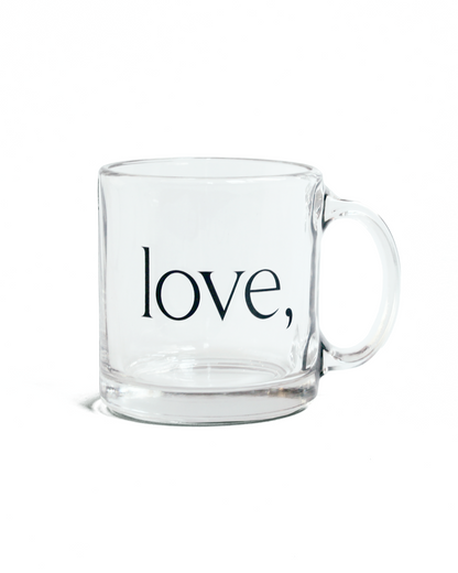Clear glass mug with 'love,' logo on a white background