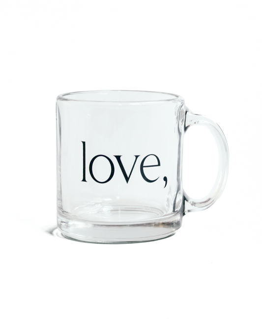 Clear glass mug with 'love,' logo on a white background