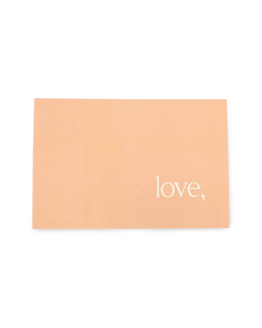 Beige card with 'love,' text on a white background