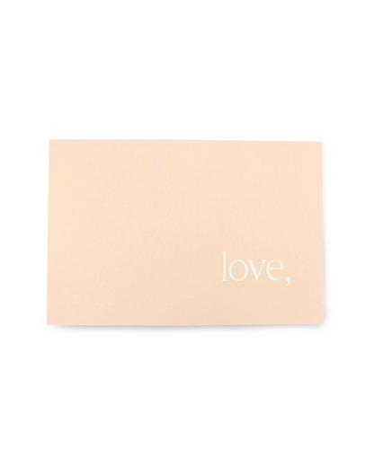 Beige card with 'love,' text on a white background