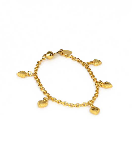 Gold bracelet with heart-shaped charms on a white background