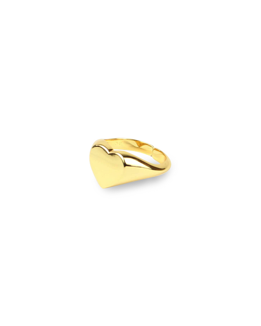Gold heart-shaped ring on a white background