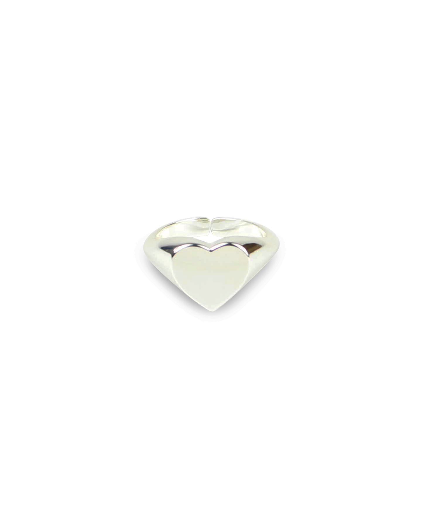 Silver heart-shaped object on a white background