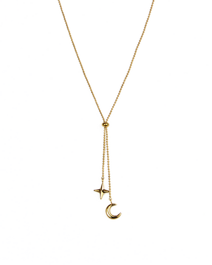 Gold necklace with star and moon pendants on a white background