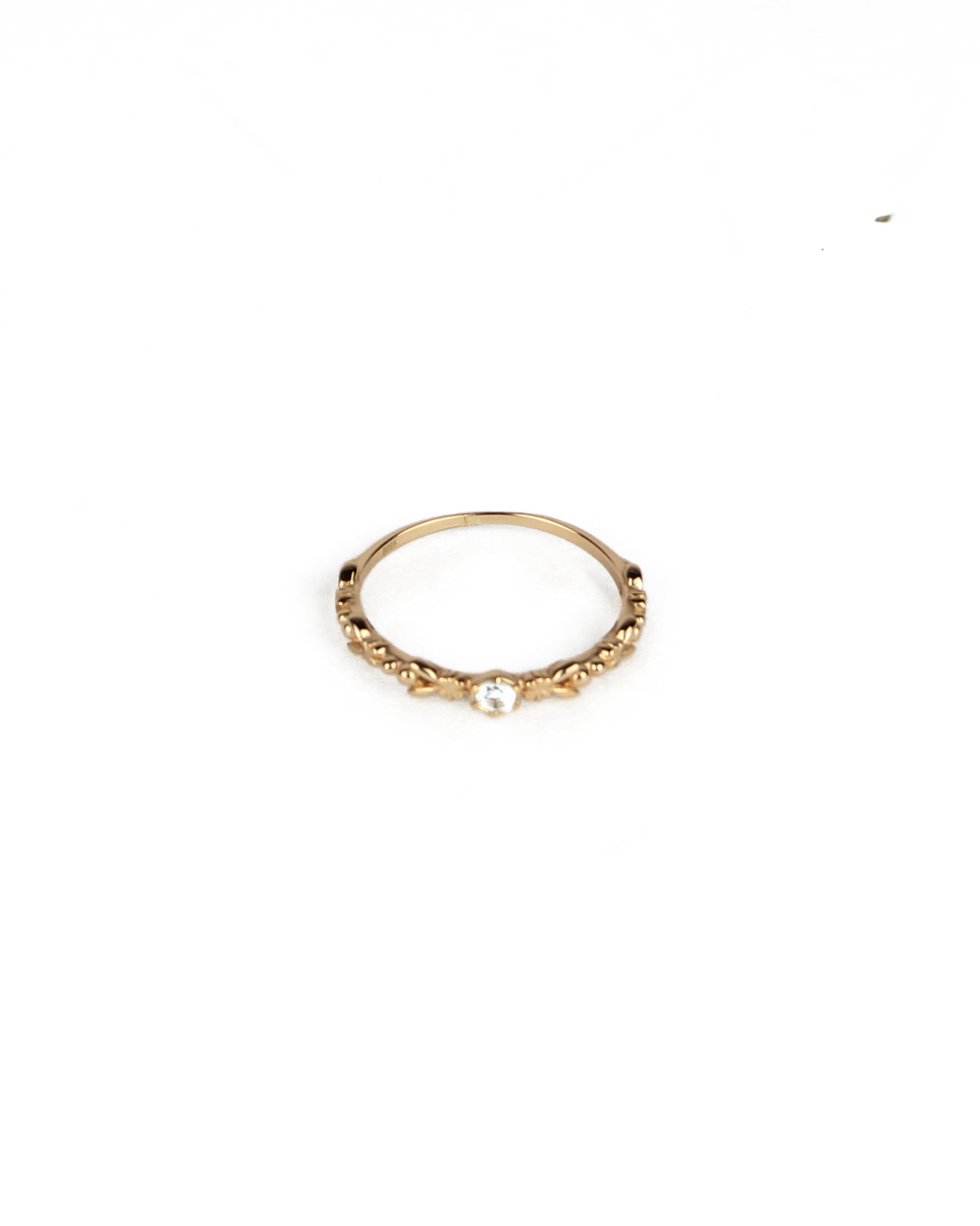 gold ring with gem stone on a white background