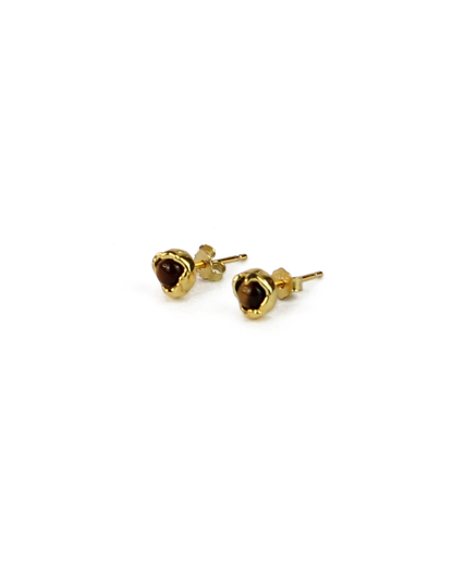 Gold stud earrings with brown gemstones on a white background