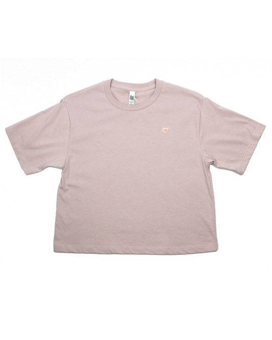 Pink t-shirt with a small logo on a white background